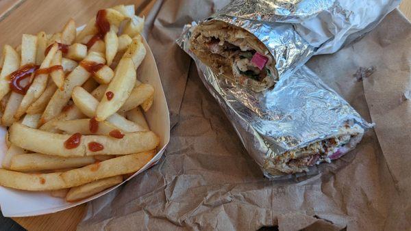 Chicken shawarma wrap and french fries. The way they roll it tight and heat it in a press is so much easier to eat than a big sloppy gyro!