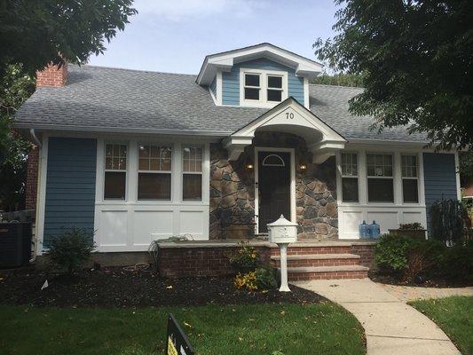 James Hardie siding /w Azek trim and panels. New portico I'm finished in Azek