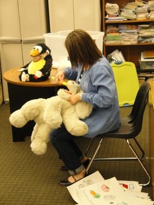 Dental Awareness Month 2013 at Atlanta Academy - Dr. M & her pal, Toothy demonstrating to children how to properly their brush.