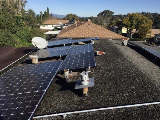 Out with the old tar and gravel roof, and adding 6 more panels