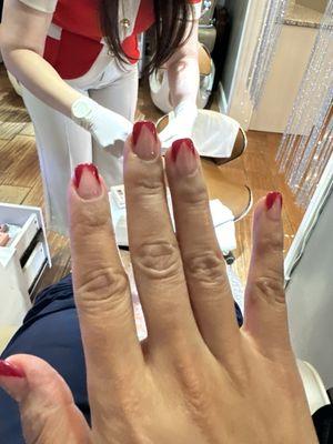 Gel manicure with red French tips