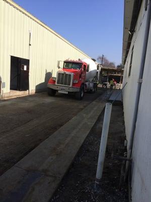 The pouring of concrete between our buildings