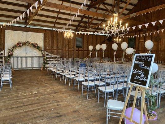 Ceremony arch and balloons with florals