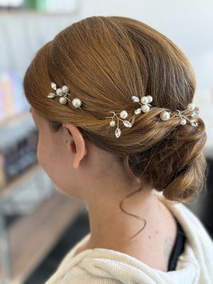 Bridal hairstyle with a simple accessory.