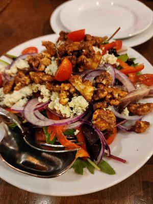 Mixed salad (pecans, onions, red peppers, blue cheese?, cherry tomatoes, greens) yum