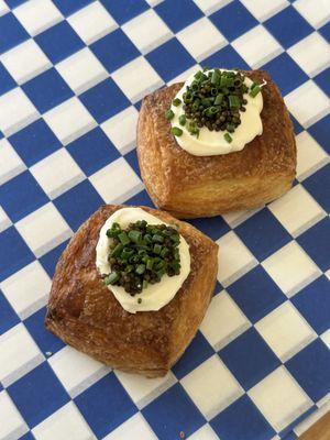 Caviar, crème fraîche and chop chives on a layered croissant tart. Available weekends.