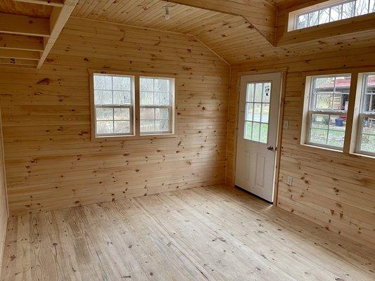 Custom shed insulated with added electrical package and finished with tongue and groove board for an office / guest space.