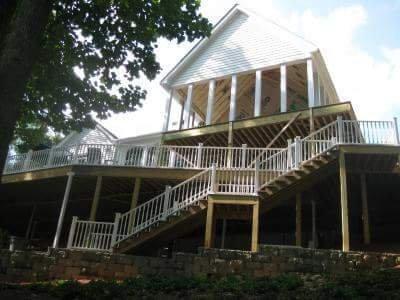 complete remodel of 1 story home now 3 story deck is as large as house was with hot tub water fall and band concert area under the deck