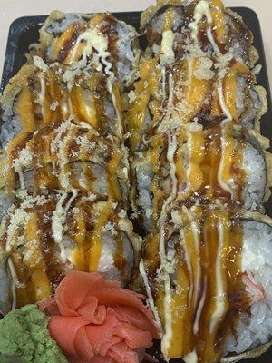 This is crunchy roll..salmon.tuna.kani.cream chees fried and top special souce