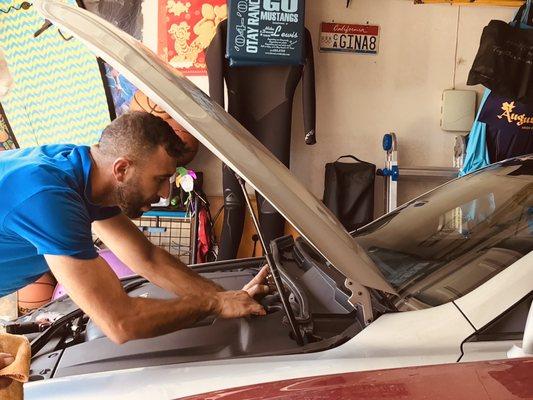 Sandy replacing the lower parts of the windshield.