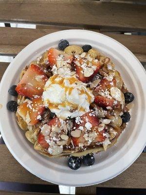 Vanilla protein waffle with almonds, strawberries, and blueberries