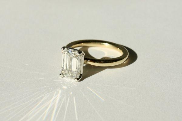 Custom emerald cut diamond solitaire engagement ring