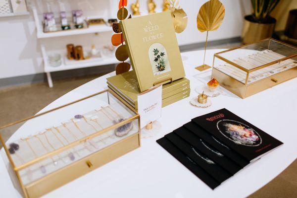 Merchandise including gold jewelry and cannabis books