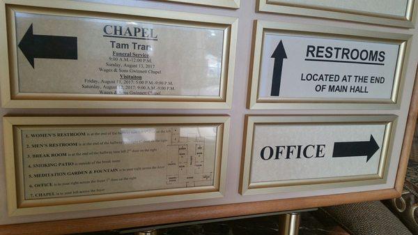 Directional signs just inside entrance.