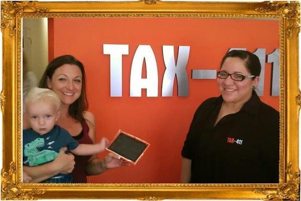 During Tax Season we have Ipod or Tablet raffles, this is one of our winners Kristin with lucky charm baby!