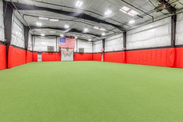 6500 square foot turf area with netted ceiling, 2 basketball hoops , and a 55 yard running lane