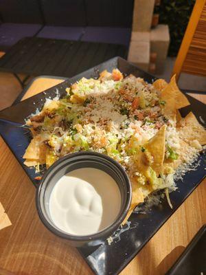 Nachos with sour cream on the side