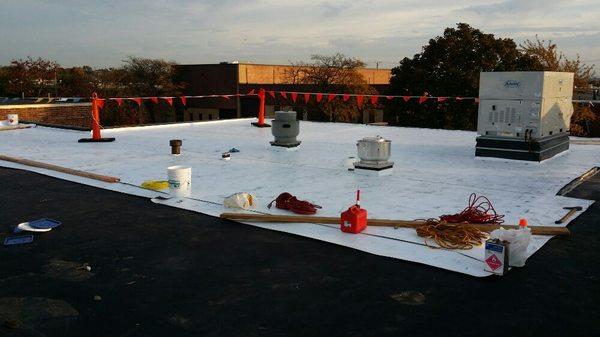 Installing Johns Manville 60 mil TPO flat roof in Schaumburg Illinois