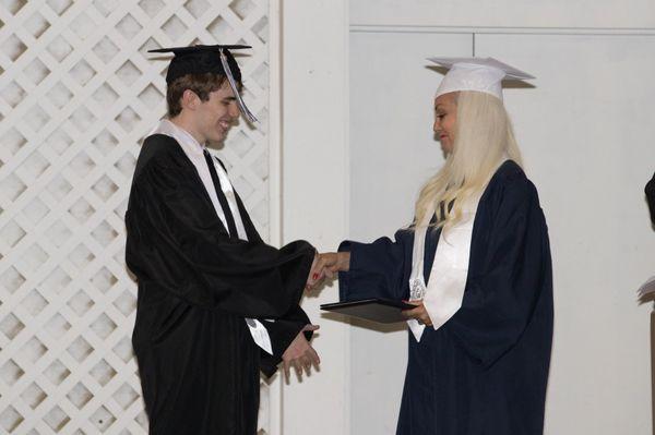 Cumberland Graduates Headmaster/Founder, Debbi Scarborough, congratulates students as they transition into adulthood.