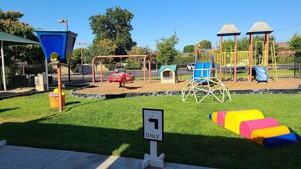 Playground with basketball ball hoop, soft climbers and dome