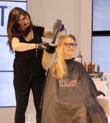 On stage teaching Brazilian Blowout to hair stylists at a trade show in Chicago.