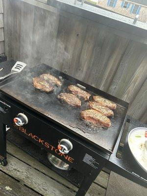 Strip steaks on the blackstone. Found a recipe that you bast with butter each minute you flip. It was perfection.