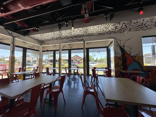 Seating with large open windows -- love the painted walls and ceilings