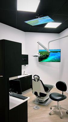 One of our treatment rooms. We offer YouTube TV/Netflix & Beats by Dre headphones to keep everyone entertained while in the chair.