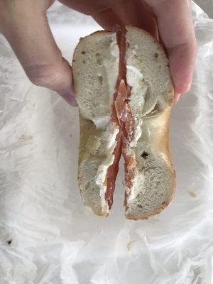 Half of a $9 plain "bagel" with lox, untoasted.