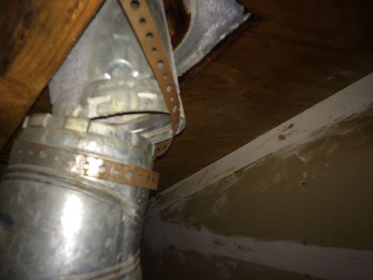 Disconnect furnace vent pipe at attic