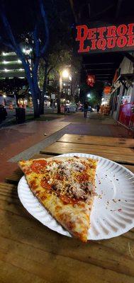 Sausage and pepperoni outside on the picnic table