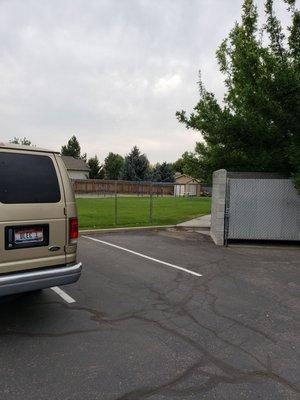 Fenced playground from parking lot