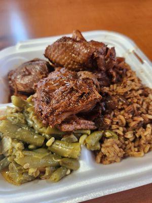 Brown stewed chicken with rice and beans and green beans