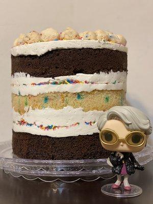 Cake next to a Miranda Priestly funko pop for scale and because Teresa the owner is a BOSS.