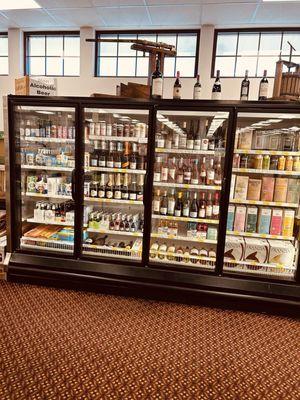 Display Case with variety  alcoholic beverage! Bottles, boxes and cans.