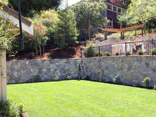 Structural wall built in a tiered style to add additional space and utilize as much of the hillside as possible with a cosmetic finish.#1