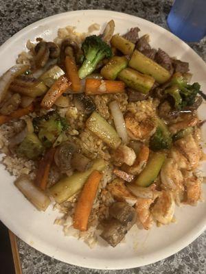 Steak and shrimp combo with fried rice and vegetables