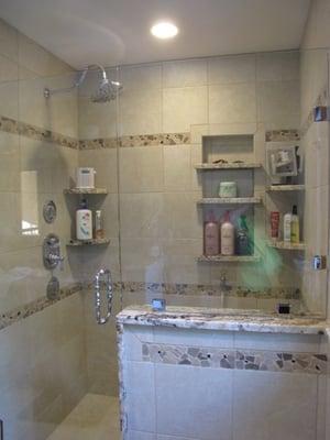 AFTER: A complete bathroom renovation with a custom shower pan and detailed finish work