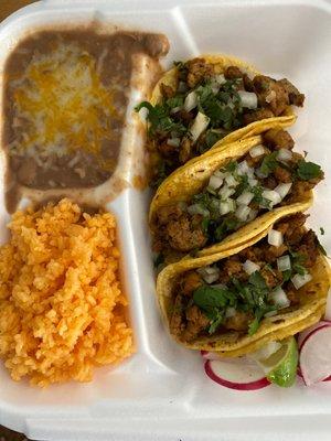 3 chicken soft tacos, rice and beans.