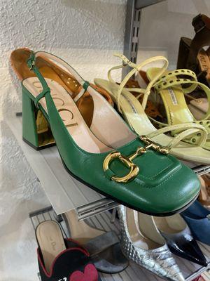 Green Gucci slingbacks with horsebit detail