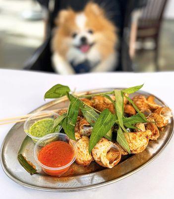 Ồc Nhảy Nương Bơ Tởi: Grilled Escargot in Butter Garlic w/ fresh rau ram, ginger fish sauce | $18.95