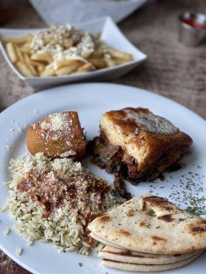 Moussaka, pilaf, roast potato, pita, Greek fries.