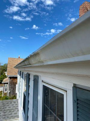 Side by side of a cleaned vs uncleaned gutter