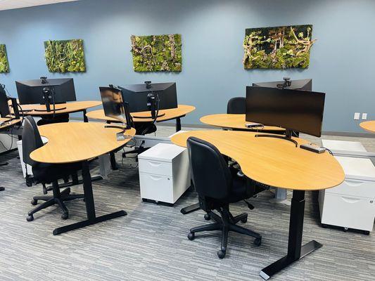 Dedicated desk area with monitors and docking stations