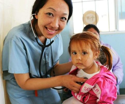 Dr. Lisa Ma in Action Volunteering her time