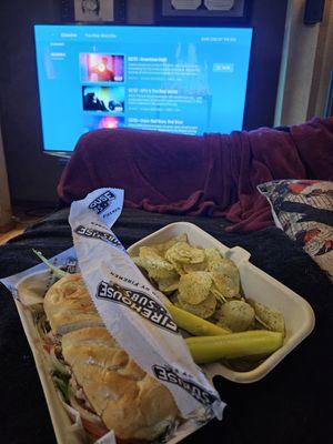 4/9/2024 - A turkey sub, Lays sour cream and onion chips and pickles on delivery.