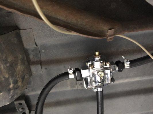 Leaking fuel regulator.