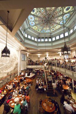 Main dining room of John's, including original stained glass from 19th century church.