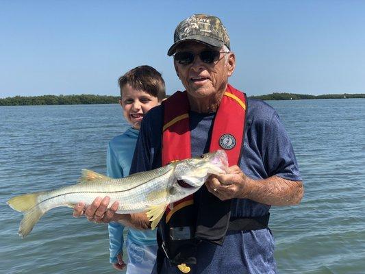 Ken and grandson and a pretty Snook.