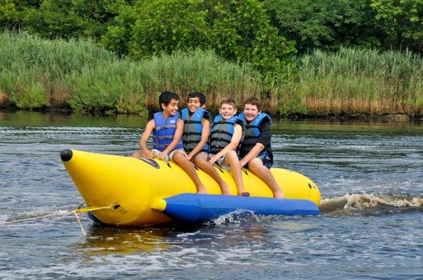 Navigator boys banana boating down Mill River